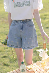 Pantalones cortos bordados con flores danzantes